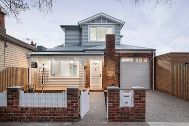 Photo of a large traditional home design in Melbourne.
