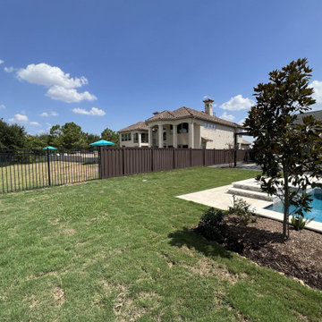 Dark Brown Composite Trex Fence and Black Iron Fence