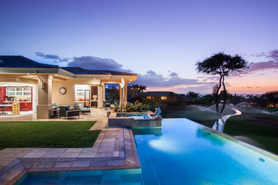 Inspiration for a mid-sized tropical courtyard tile patio remodel in Hawaii with a fire pit and a roof extension