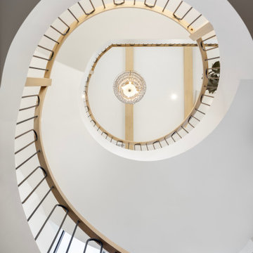 Interior - Circular Stair with Wood and Iron Balustrade