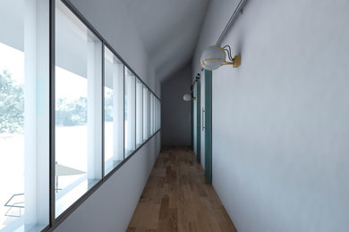 Modelo de galería actual con suelo de madera clara, techo estándar y suelo beige