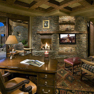 Home office in Phoenix with a stone fireplace surround and a corner fireplace.