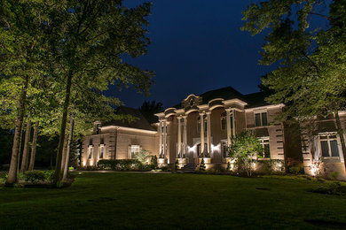 Photo of a mediterranean two-storey stucco beige exterior in Columbus.