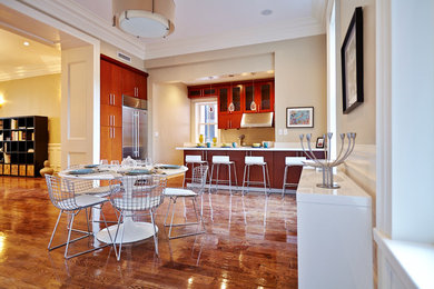 Example of a mid-sized trendy dark wood floor kitchen/dining room combo design in New York with beige walls and no fireplace