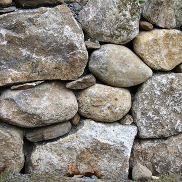 Dry stacked wall keeps the spirit of the old farm wall