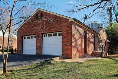 Inspiration for a mid-sized timeless brown one-story brick gable roof remodel in DC Metro