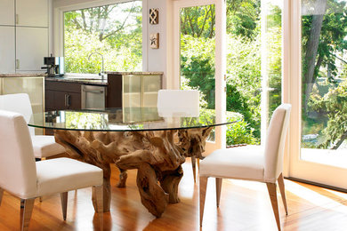 Example of a mid-sized trendy medium tone wood floor and brown floor kitchen/dining room combo design in Toronto with green walls and no fireplace