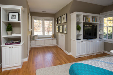 Bedroom - large contemporary guest light wood floor and brown floor bedroom idea in Raleigh with beige walls and no fireplace