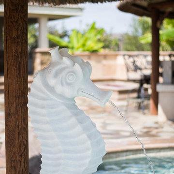 Tropical Beach Entry Pool & Spa with a Rock Slide & Grotto