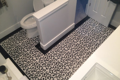 Example of a small trendy 3/4 vinyl floor and multicolored floor bathroom design in Boise with gray walls, an undermount sink and solid surface countertops