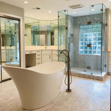 Freestanding Tub is the Center of White on White Owner's Bath