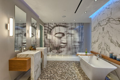 Large trendy master white tile and marble tile mosaic tile floor and multicolored floor freestanding bathtub photo in Minneapolis with medium tone wood cabinets, white walls, an integrated sink and wood countertops