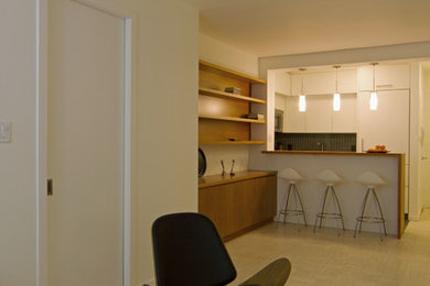 Example of a small danish light wood floor and white floor great room design in New York with white walls