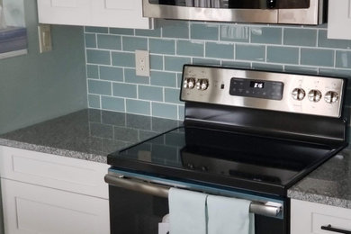 Kitchen - modern kitchen idea in Other