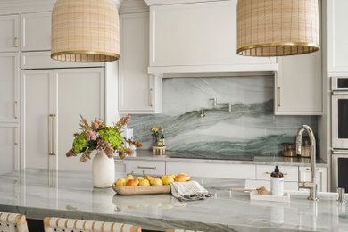 Large transitional single-wall medium tone wood floor eat-in kitchen photo in Charlotte with a farmhouse sink, shaker cabinets, gray cabinets, quartzite countertops, green backsplash, stainless steel appliances, an island and green countertops