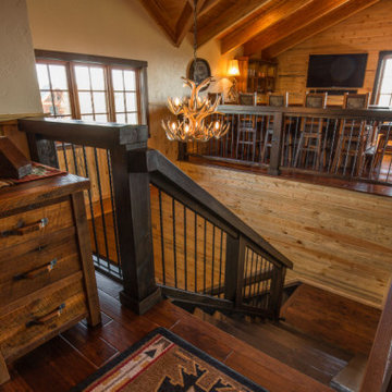 Rustic Stairway Landing | Handcrafted Woodwork & Warm Cabin Detailing