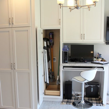Alpha, IL White and Gray Kitchen with Hidden Laundry and Raised Dishwasher