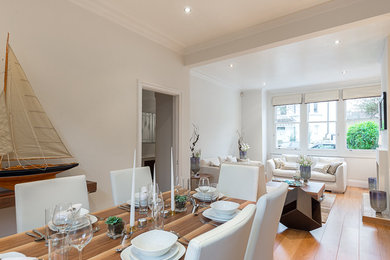 Dining room - large transitional dining room idea in London