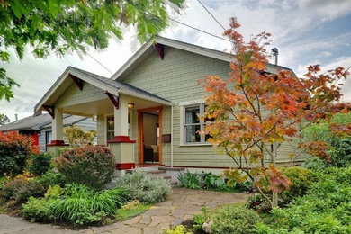 Inspiration for a small arts and crafts one-storey green exterior in San Francisco with wood siding and a gable roof.