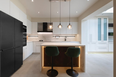 Kitchen in London with quartz worktops and an island.