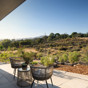 A little farm below a hillside resort-style off-the-grid view home