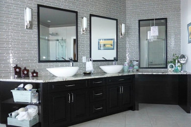 Inspiration for a large contemporary master bathroom in Toronto with raised-panel cabinets, black cabinets, gray tile, matchstick tile, grey walls, porcelain floors, a vessel sink, engineered quartz benchtops and beige floor.
