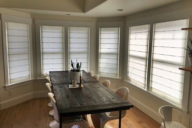 Example of a mid-sized eclectic light wood floor kitchen/dining room combo design in Seattle with beige walls