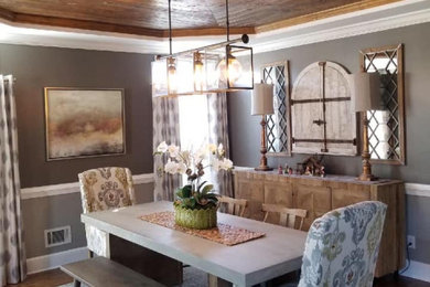 Example of a huge eclectic medium tone wood floor and brown floor kitchen/dining room combo design in Other with gray walls and no fireplace