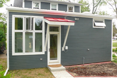 Inspiration for a modern gray concrete fiberboard exterior home remodel in Detroit