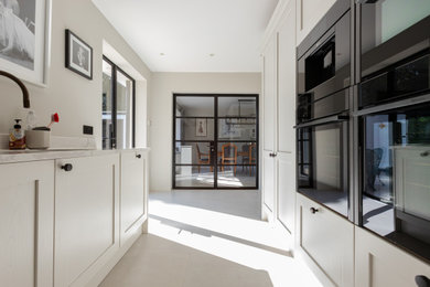 This is an example of a contemporary kitchen in Kent.