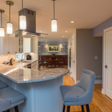 Modern Kitchen with White Flat Panel Shaker Cabinets & Natural Stone Backsplash