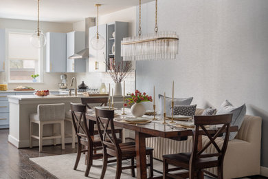 Kitchen/dining room combo - mid-sized transitional medium tone wood floor, brown floor and wallpaper kitchen/dining room combo idea in DC Metro with blue walls