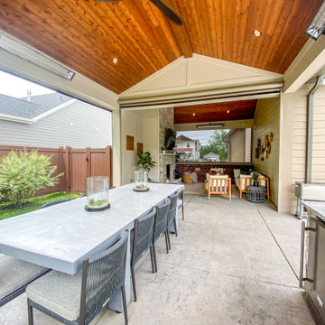 Pool-Side Covered Patio with a Fireplace and Outdoor Kitchen