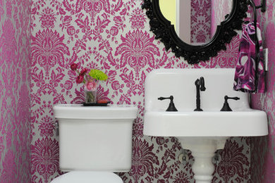 Inspiration for a small eclectic powder room in Nashville with a two-piece toilet, multi-coloured walls, porcelain floors and a pedestal sink.