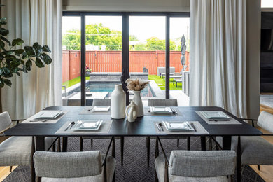 Example of a minimalist kitchen/dining room combo design in Nashville