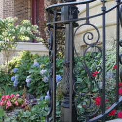 Solid stone stairs with ornamental iron railing - Products
