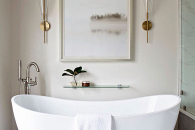 Bathroom - large transitional master white tile and porcelain tile porcelain tile, gray floor, double-sink and vaulted ceiling bathroom idea in Kansas City with recessed-panel cabinets, medium tone wood cabinets, a one-piece toilet, white walls, an undermount sink, quartz countertops, a hinged shower door, white countertops and a built-in vanity