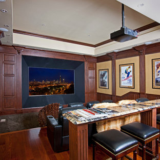Home theater - traditional brown floor home theater idea in Charlotte with a projector screen