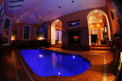 Inspiration for a small mediterranean indoor tile and custom-shaped pool remodel in Other