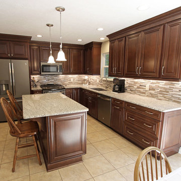 Waypoint Cherry Chocolate Cabinets and Giallo Ornamental Granite Countertops
