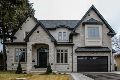 Inspiration for a transitional gray gable roof remodel in Toronto