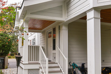 Arts and crafts side yard deck photo in DC Metro with a roof extension