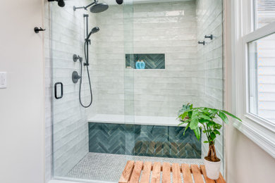 Example of a mid-sized trendy master ceramic tile laminate floor, white floor and single-sink bathroom design in Other with shaker cabinets, medium tone wood cabinets, a two-piece toilet, white walls, an undermount sink, quartz countertops, white countertops and a built-in vanity