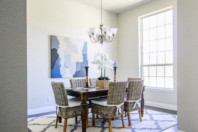 Example of a large country dark wood floor kitchen/dining room combo design in Dallas with white walls