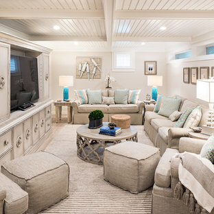 This is an example of a beach style look-out basement in Boston with beige walls, light hardwood flooring and beige floors.