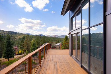 Rustic blue metal house exterior idea in Other with a metal roof