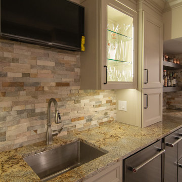 Basement Showing Warm Colors, Straight Lined Cabinets and Stacked Stone