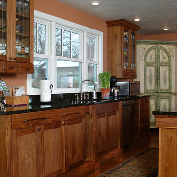Copper Accented Craftsman Style Kitchen with Walnut Cabinets