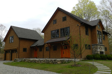 Arts and crafts brown wood exterior home photo in New York