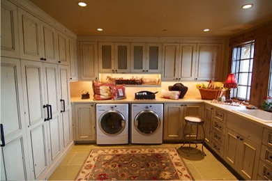 Inspiration for a rustic beige tile and ceramic tile ceramic tile bathroom remodel in Other with recessed-panel cabinets, distressed cabinets and solid surface countertops